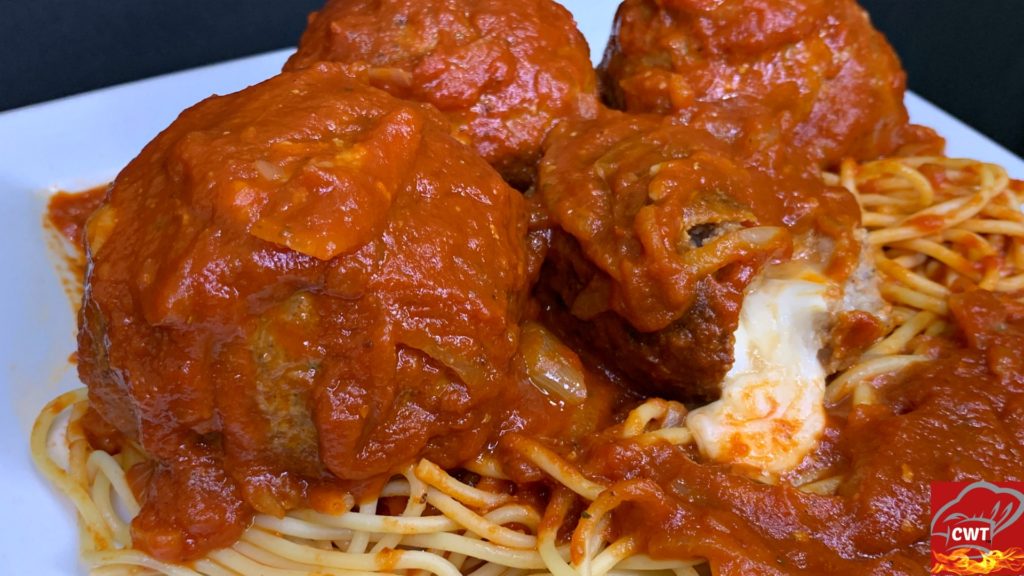 Mozzarella Stuffed Meatballs Recipe delicious tender juicy perfectly seasoned meatballs filled with melted gooey fresh mozzarella cheese. Satisfying cheese pulls with every bite.