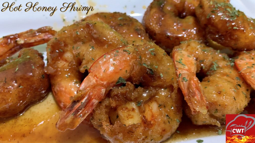 Spicy Honey Fried Shrimp perfectly seasoned and dredge lightly in flour, eggs, and breadcrumbs. And tossed in a delicious warm hot honey sauce.